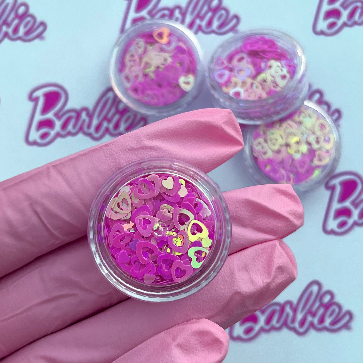 Corazones fucsia con destellos barbi